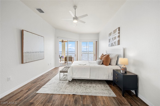 bedroom with ceiling fan, dark hardwood / wood-style floors, and access to outside