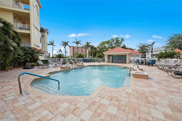 view of pool featuring a patio area and pool water feature