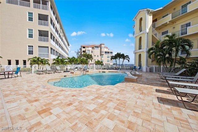 view of swimming pool with a patio