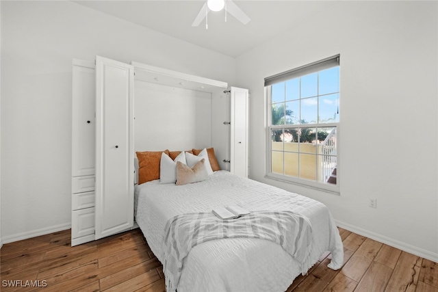 bedroom featuring ceiling fan and hardwood / wood-style flooring