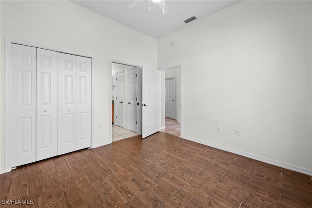 unfurnished bedroom with a closet and ceiling fan