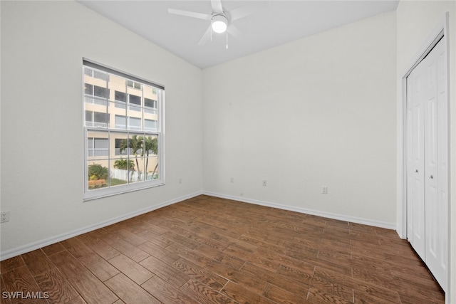 unfurnished bedroom featuring a closet, ceiling fan, and dark hardwood / wood-style floors