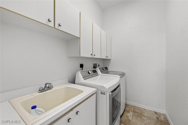 laundry room with sink, cabinets, and washing machine and dryer