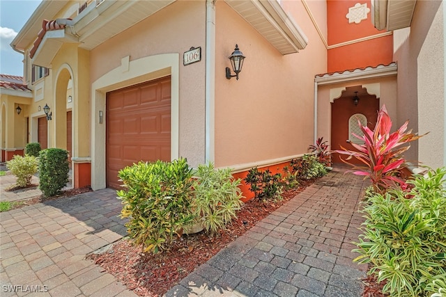 entrance to property featuring a garage