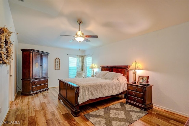 bedroom featuring light hardwood / wood-style floors and ceiling fan