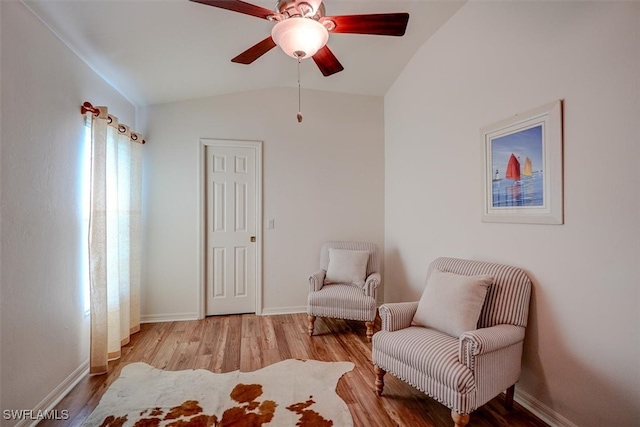 sitting room featuring ceiling fan, lofted ceiling, and light hardwood / wood-style floors