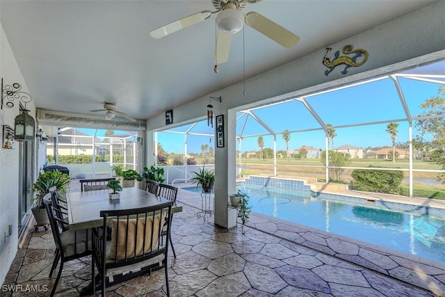 view of pool featuring a patio and glass enclosure