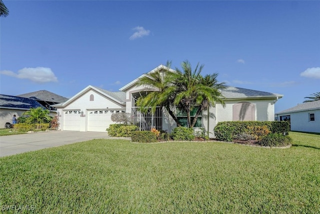 view of front of house featuring a garage and a front yard