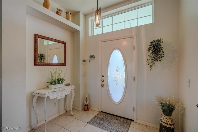 entrance foyer with light tile patterned floors