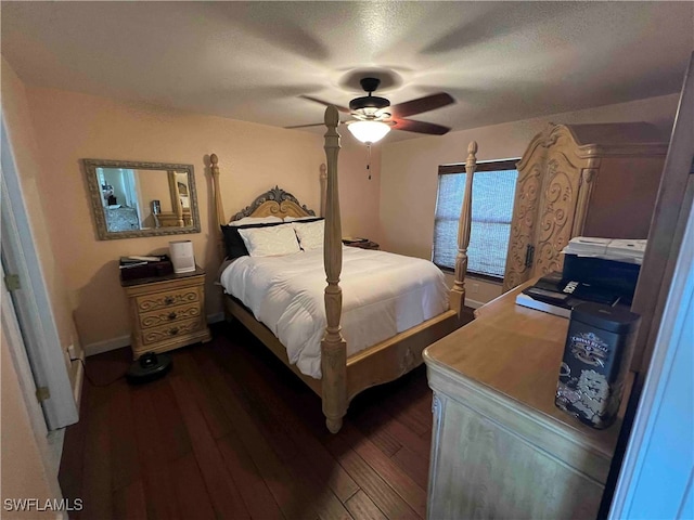 bedroom with ceiling fan and dark hardwood / wood-style floors