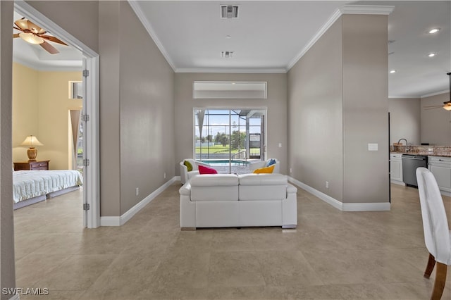 living room with ceiling fan and crown molding