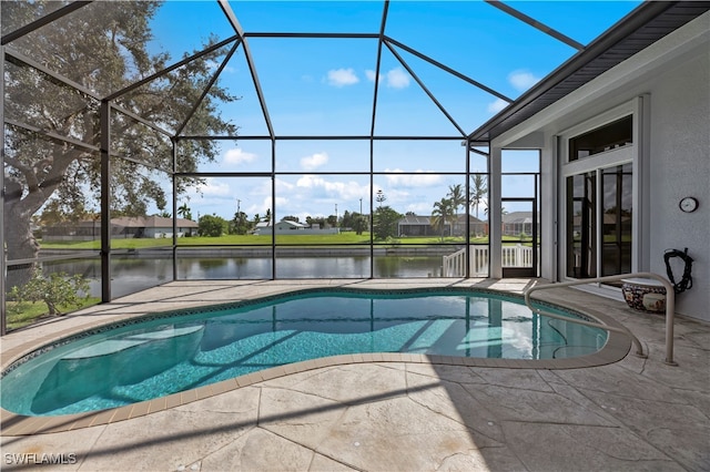 view of swimming pool with a lanai, a patio, and a water view