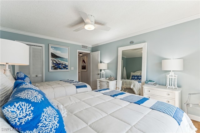 bedroom featuring ceiling fan, a closet, crown molding, and a textured ceiling