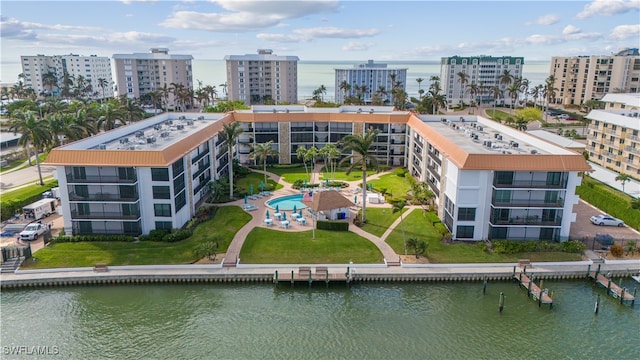 birds eye view of property featuring a water view