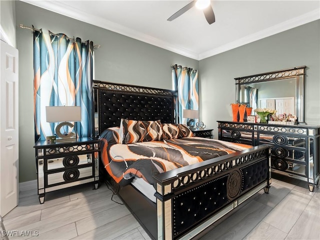 bedroom featuring wood-type flooring, ceiling fan, and ornamental molding