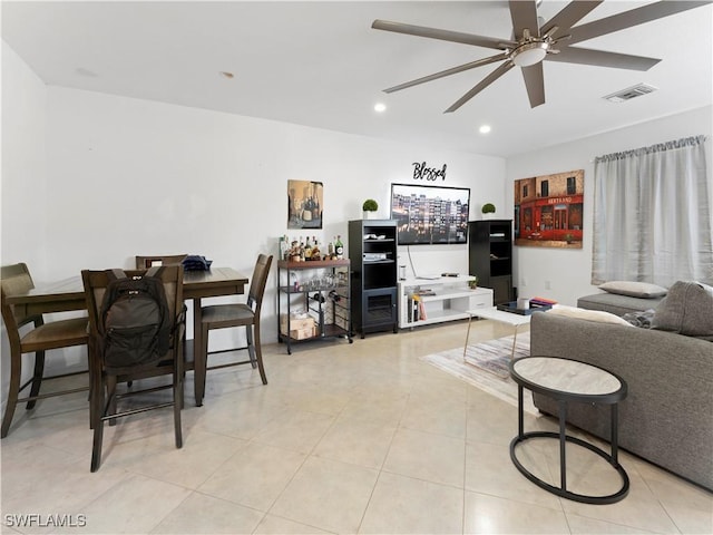 living room featuring ceiling fan and light tile patterned floors