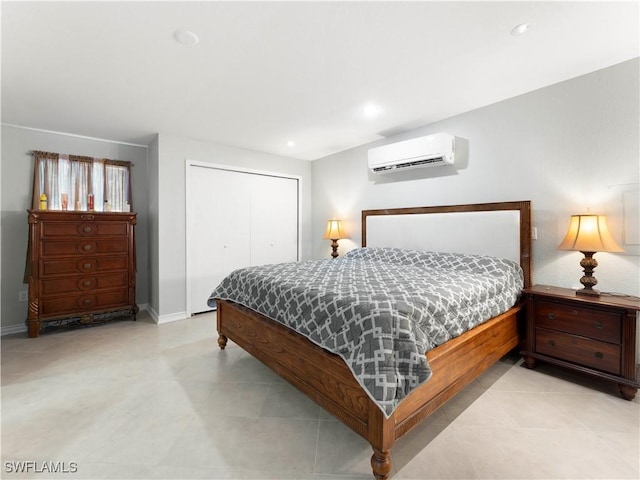 bedroom with a wall unit AC and a closet