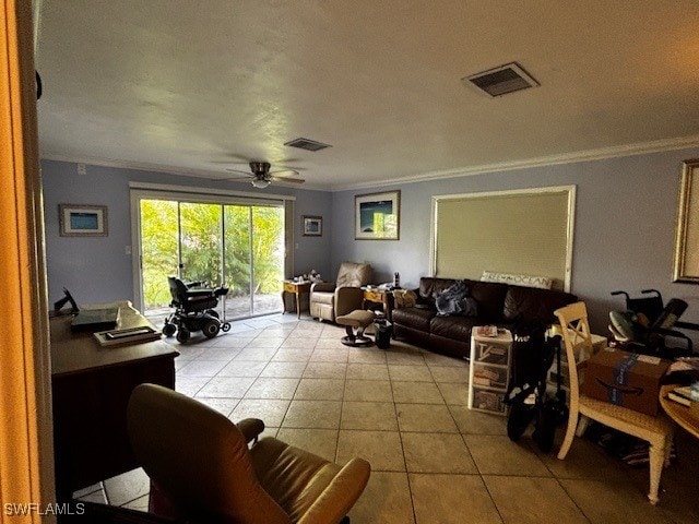 living room with ornamental molding, ceiling fan, and light tile patterned floors