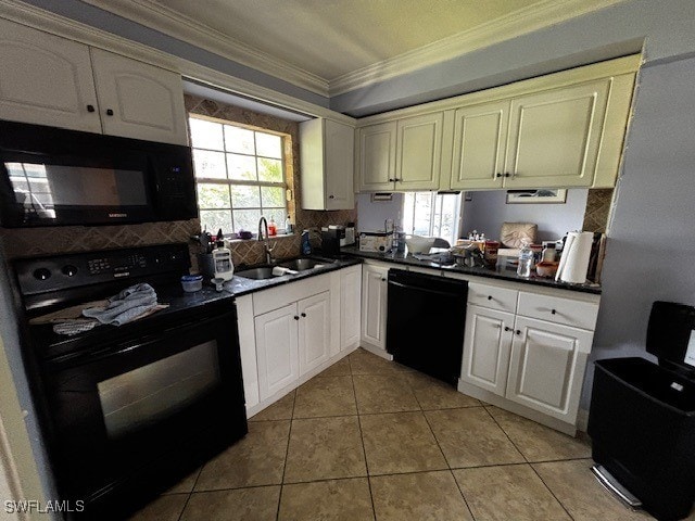 kitchen featuring ornamental molding, white cabinetry, black appliances, and sink