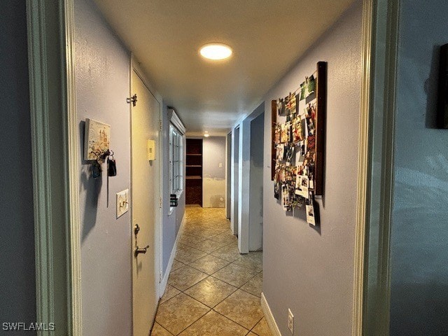 hallway featuring light tile patterned floors