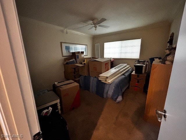 carpeted bedroom featuring ceiling fan and ornamental molding