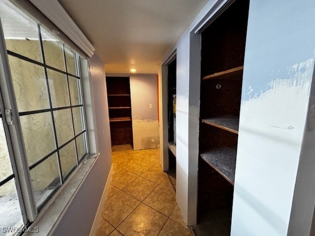 hall featuring tile patterned flooring