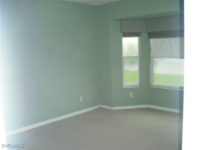 spare room featuring carpet flooring