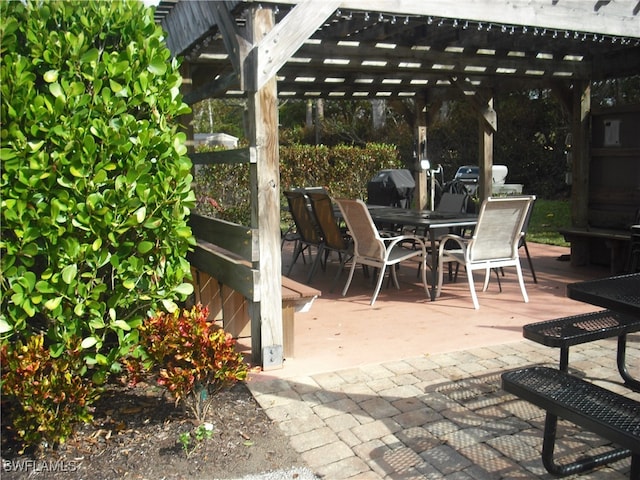 view of patio / terrace featuring a pergola and a grill