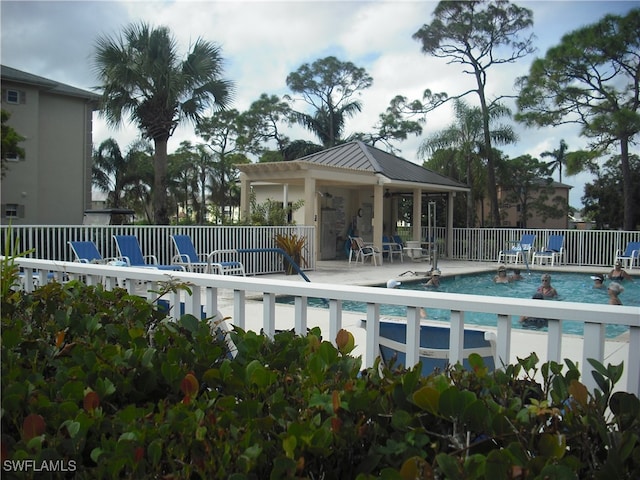 view of pool featuring a patio