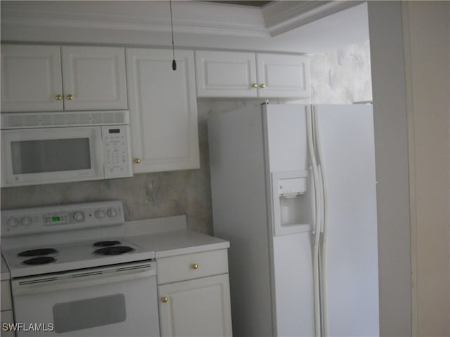 kitchen with backsplash, white appliances, and white cabinets