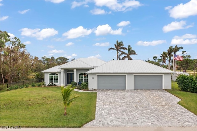 ranch-style house with a garage and a front yard