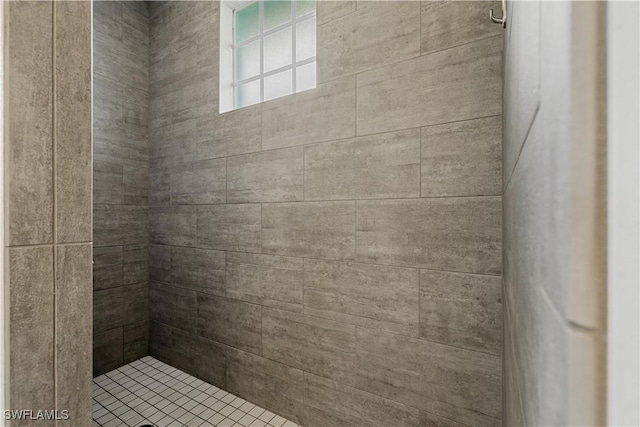 bathroom with tiled shower