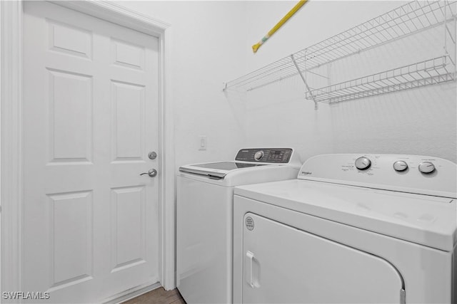 clothes washing area with washer and dryer