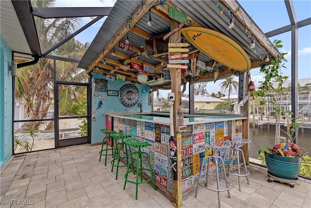 unfurnished sunroom with bar