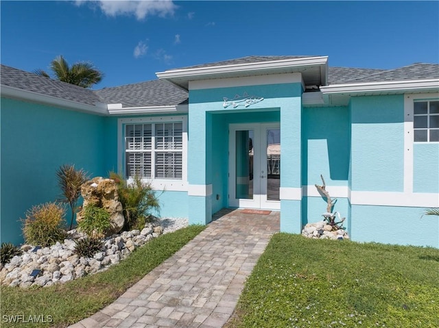 doorway to property with a yard