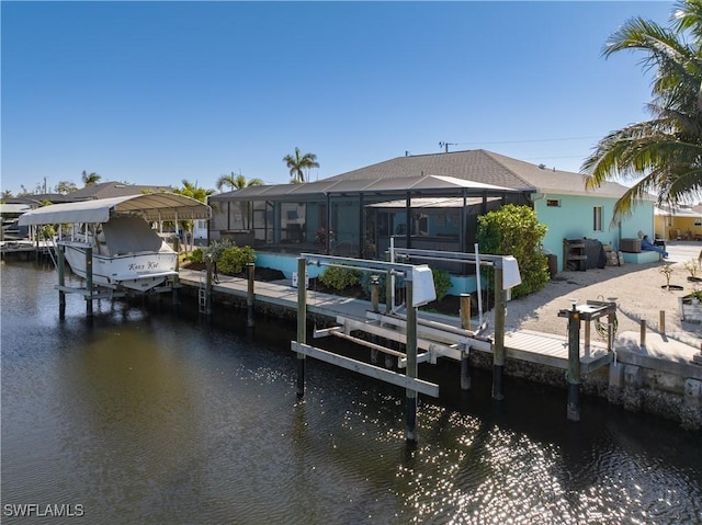 view of dock with a water view and glass enclosure