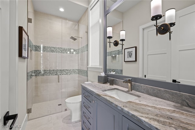 bathroom with walk in shower, tile patterned floors, vanity, and toilet