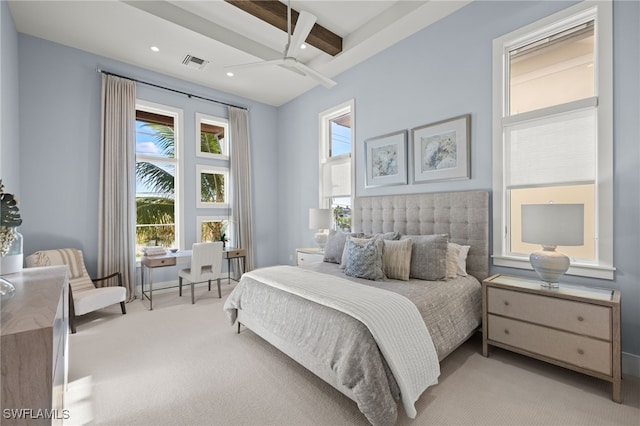 carpeted bedroom featuring beamed ceiling, ceiling fan, and multiple windows