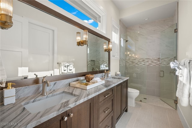 bathroom featuring vanity, toilet, tile patterned floors, and walk in shower