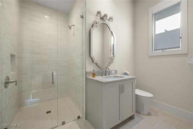 bathroom featuring tile patterned flooring, vanity, a shower with door, and toilet