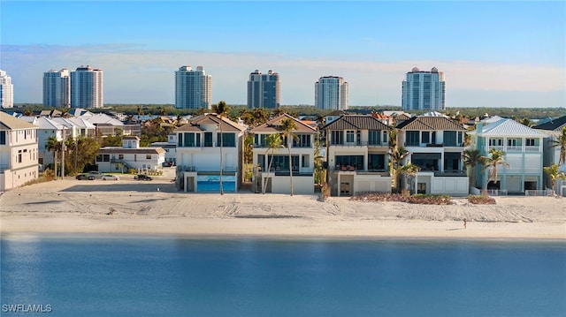 exterior space featuring a view of the beach and a water view