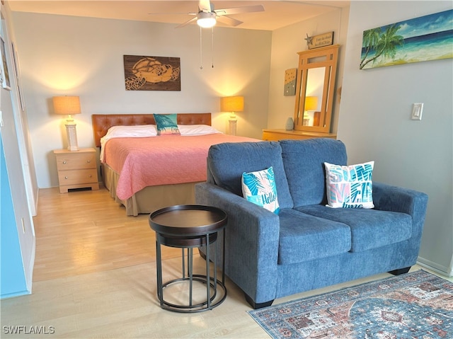 bedroom with ceiling fan and light hardwood / wood-style flooring