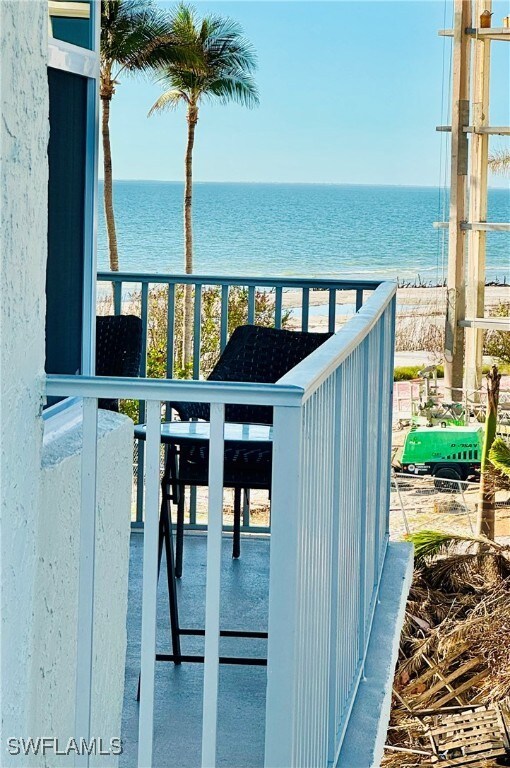 balcony featuring a water view