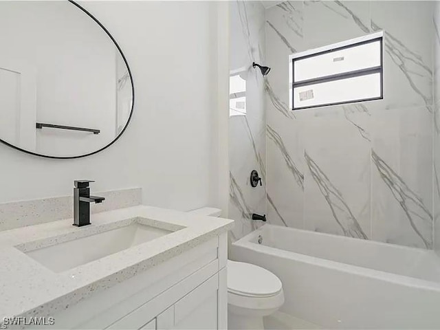 full bathroom with vanity, toilet, and tiled shower / bath