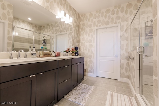 bathroom featuring vanity and an enclosed shower