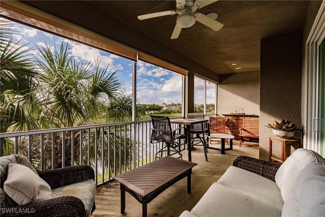 exterior space with an outdoor living space and ceiling fan