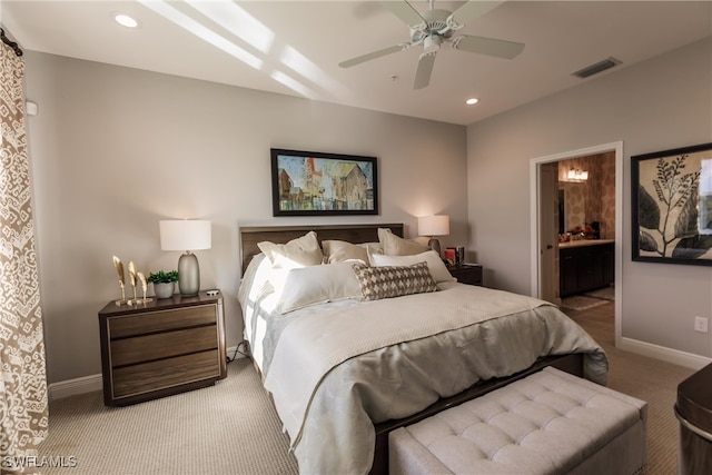 bedroom featuring carpet, ceiling fan, and ensuite bath