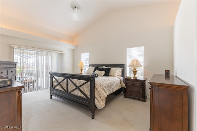 carpeted bedroom featuring access to outside, multiple windows, ceiling fan, and high vaulted ceiling