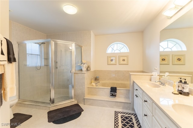 bathroom featuring vanity, a wealth of natural light, tile patterned floors, and plus walk in shower