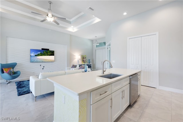 kitchen featuring white cabinetry, sink, dishwasher, ceiling fan, and a kitchen island with sink